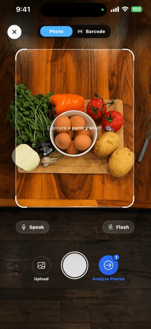 Custrd camera pointed at a cutting board of fresh ingredients on a wooden table